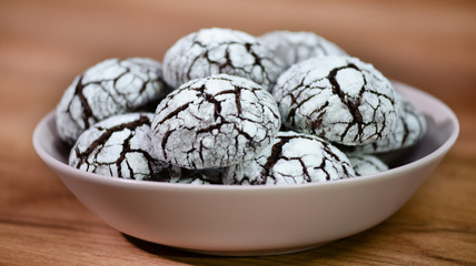 Homemade chocolate crinkles cookies. Biscuits with icing sugar.