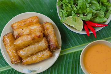 Vietnamese fried spring rolls with fresh vegetable and peanut sauce