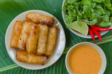 Vietnamese fried spring rolls with fresh vegetable and peanut sauce