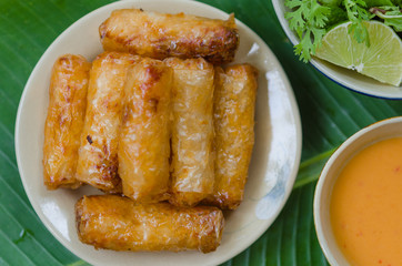 Vietnamese fried spring rolls with fresh vegetable and peanut sauce