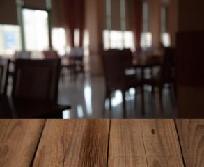 vintage wooden table on blurred cafe background dining room restaurant