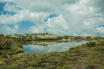 Lake among rocky terrain on highlands