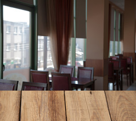 vintage wooden table on blurred cafe background dining room restaurant