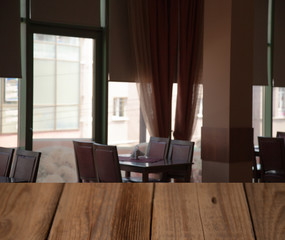 vintage wooden table on blurred cafe background dining room restaurant