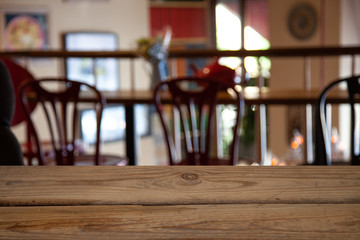 vintage wooden table on blurred cafe background dining room restaurant
