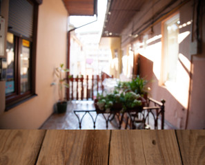 vintage wooden table on blurred cafe background dining room restaurant