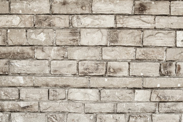 Wall of stone grey bricks, abstract background. Brick wall building