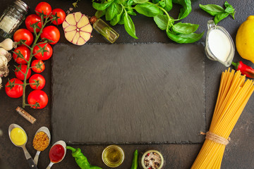 pasta, spaghetti or bucatini and tomato sauce ingredients. food background. copy space