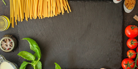 pasta, spaghetti or bucatini and tomato sauce ingredients. food background. copy space