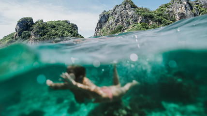 Beautiful woman making an excursion to phi phi island and maya beach in Thailand