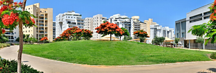 Panorama of a new residential area with modern houses and a large landscaping of the territory of the city of Holon in Israel