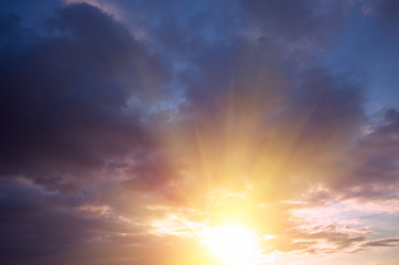 The last rays of the sun dramatic sunset of all colors of the rainbow.