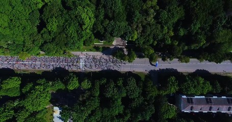 Aerial shot of marathon runners on asphalt road