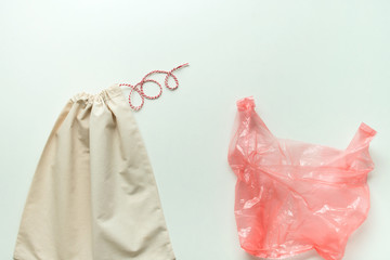 Fototapeta na wymiar concept of using cotton reusable bag instead of plastic