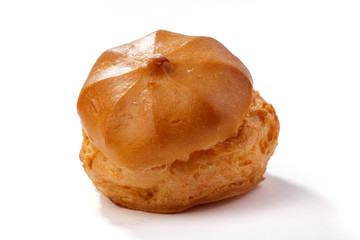 Profiterole or eclair, homemade sweets, close-up, isolated on white background.