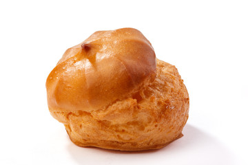 Profiterole or eclair, homemade sweets, close-up, isolated on white background.
