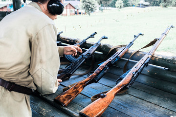 at the shooting range. military reload automatic machine for shooting. there is toning.