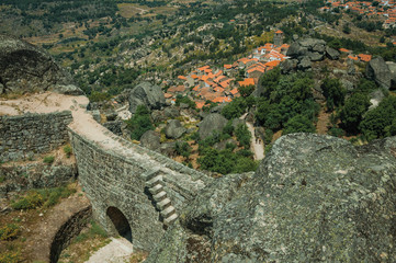 Fototapeta na wymiar Wall with gateway in a castle on rocky hilltop at Monsanto