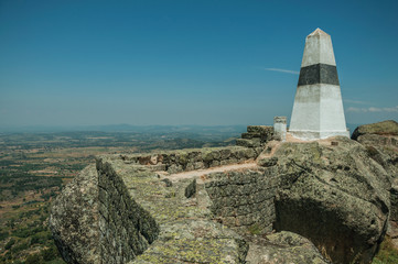 Geodetic pillar on rocky hilltop at the Castle of Monsanto