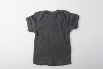 Layout black children's t-shirt on a white background.Mockup .Flat lay