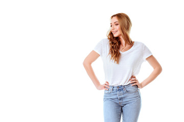 Fototapeta premium Portrait of emotive good-looking caucasian woman laughing while looking aside and standing against white background.