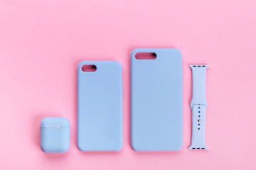 Up to date technology.Top view of diverse personal accessory laying on the pink background