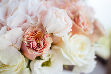 Wedding flowers, bridal bouquet closeup. Decoration made of roses, peonies and decorative plants, close-up, selective focus, nobody, objects