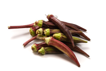 Fresh organic red okra isolated on a white background