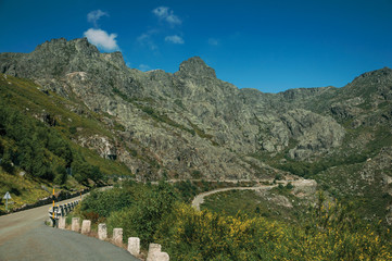 Fototapeta na wymiar Long roadway passing through rocky landscape