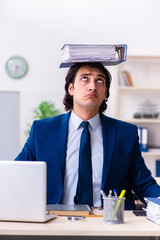 Young businessman sitting and working in the office