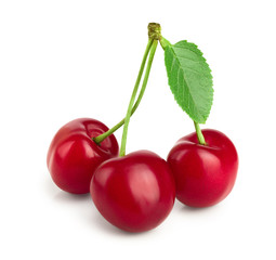 Sweet red cherries with leaves isolated on white background macro