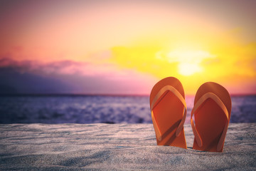 Stylish flip flops on beach