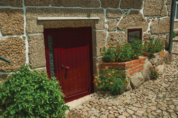Facade of stone house with a wooden door
