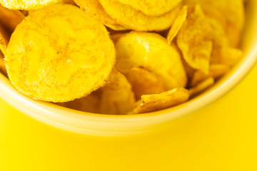 Baked Plantain Chips in Yellow bowl - a healthy snack