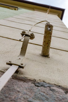 Old lightning protection in a detached house. Lightning protection cables.