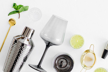 Set of bar accessories for cocktail making. Shaker, jigger, glass, spoon  and  other bar tools with...