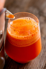 process of making juice in a juicer, process preparation of fresh juice in juicer, carrot juice