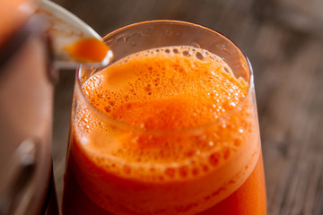 process of making juice in a juicer, process preparation of fresh juice in juicer, carrot juice