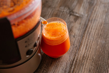 process of making juice in a juicer, process preparation of fresh juice in juicer, carrot juice