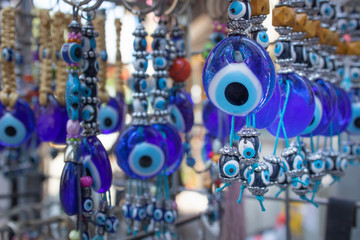 Fototapeta na wymiar Traditional evil eye bead. Souvenir. Blurred background. To bring good luck