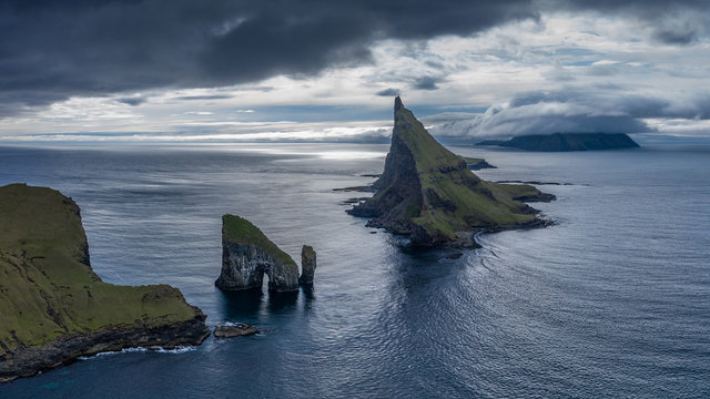 Drangarnir, Tindholmur and Mykines islands drone aereal view from Vagar, Faroe Islands 16:9