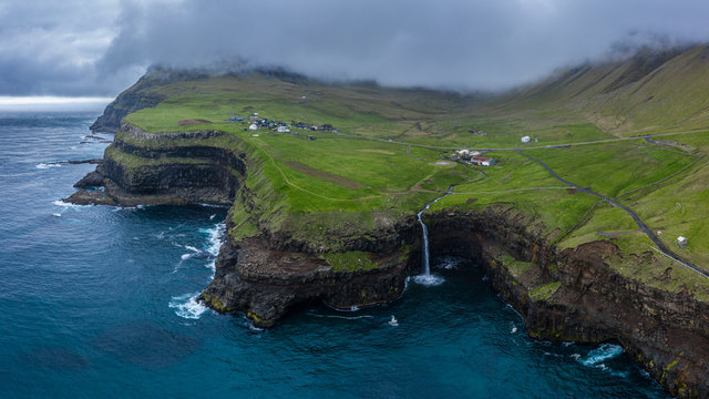 Mulafossur waterfall aerial drone view in Gasadalur, Vagar, Faroe Islands  16:9