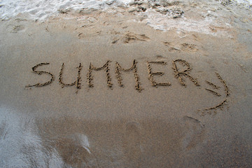 Text Summer on a beach sand