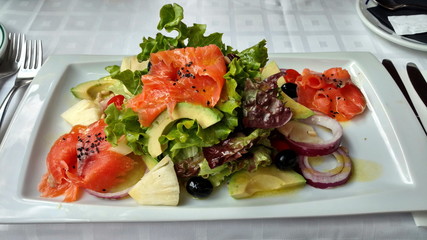 Canarian salad of salmon, avocado, pineapple, olives and chopped onions. 