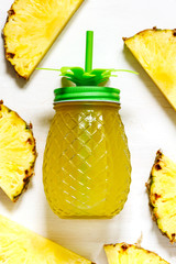 Pineapple juice and slices of fresh pineapple