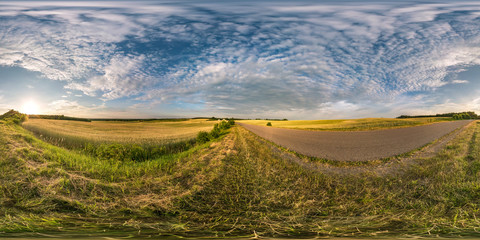 spherical hdri panorama 360 degrees angle view near asphalt road among fields in summer evening sunset with cirrocumulus clouds in equirectangular projection, ready VR AR virtual reality content