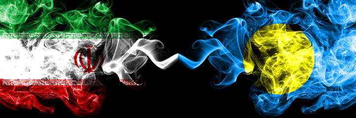 Iran vs Palau, Palaulan smoky mystic states flags placed side by side. Thick colored silky smokes flag combination of Iranian and Palau, Palaulan