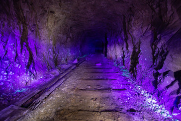 Abandoned uranium mine illuminated by ultraviolet light