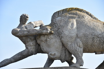 Fototapeta na wymiar Man Wrestling Buffalo Statue between Rustaveli and Udabno, Georgia