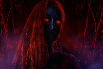 Ghost woman with dark skin, red blind eyes and red hair on night burning wood background